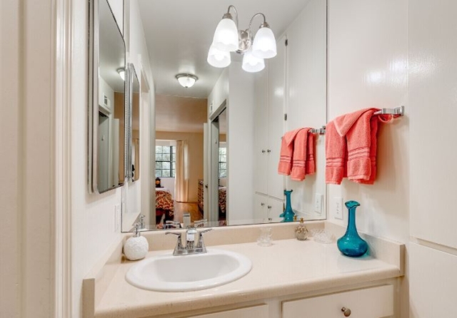 Bathrooms with Generous Vanity and Cabinet Storage at The Oaks of Pasadena Bathroom at The Oaks of Pasadena senior living community featuring spacious vanity and ample cabinet storage — part of our thoughtfully designed one- and two-bedroom apartments