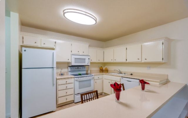 Fully Equipped Kitchens with All Major Appliances are Featured at The Oaks of Pasadena Fully equipped kitchen in The Oaks of Pasadena senior living apartment featuring all major appliances